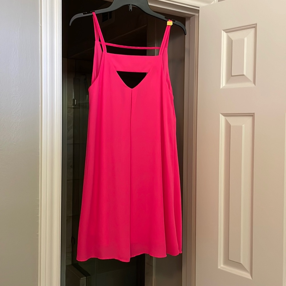Hot pink slip dress with cut out.